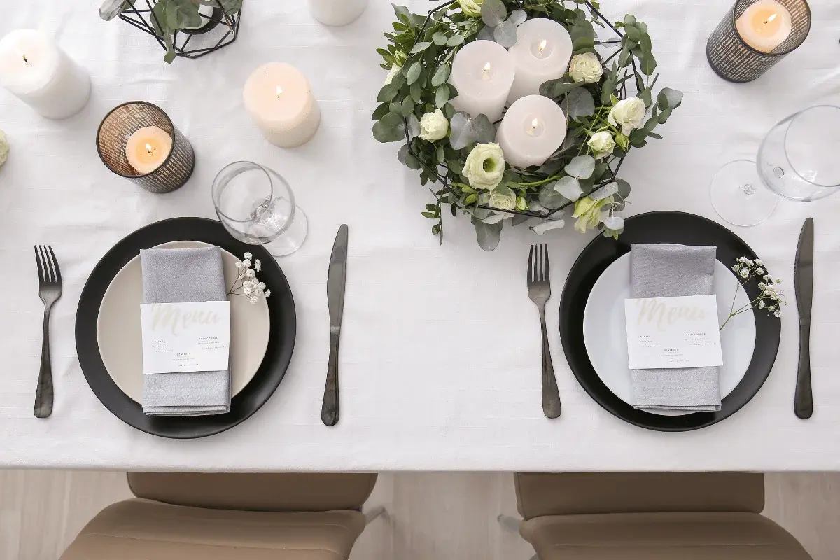 Wedding breakfast tables set with white linen and floral centrepieces